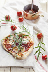 Homemade pizza on chopping board - SBDF001261
