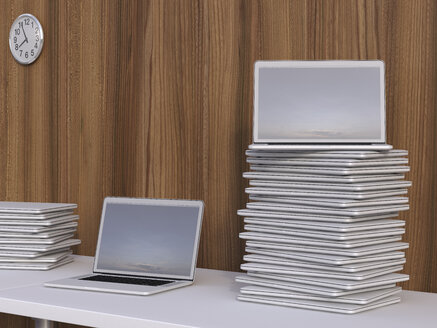 Stacks of laptops on a table in front of wooden wall, 3D Rendering - UWF000196