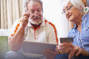 Senior couple shopping online at home - ZEF001093