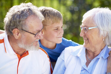 Grandparents with grandson outdoors - ZEF001137