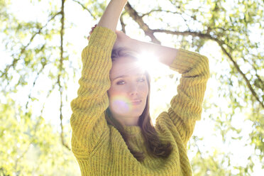 Portrait of young woman wearing knit pullover - MAEF009182