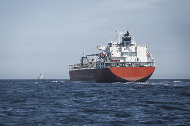 Spain, Andalusia, Tarifa, cargo ship on the ocean - KBF000187