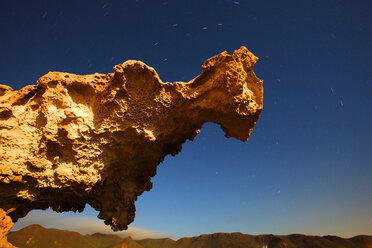 Spain, Andalusia, Natural Park of Cabo de Gata-Nijar, starry sky over rock spur - DSGF000165