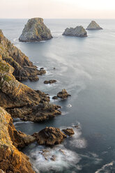 France, Brittany, Pointe de Pen-Hir, Rocky coast in evening light - DSGF000247