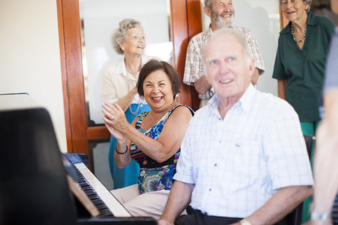 Senior people making music in a retirement village stock photo