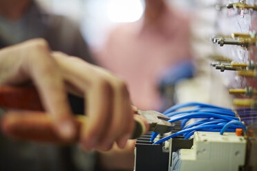 Close-up of electrician working with side cutter - ZEF001862