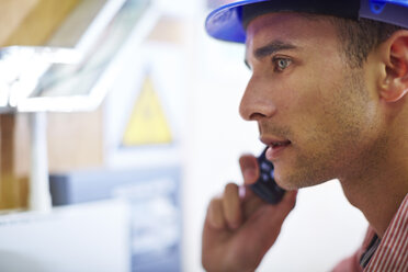 Man with hard hat on cell phone - ZEF001869