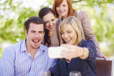 Happy friends taking selfie outdoors - ZEF001485