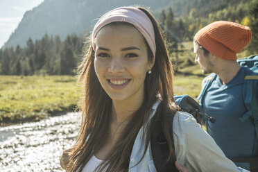 Austria, Tyrol, Tannheimer Tal, portrait of happy young female hiker - UUF002124