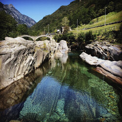 Switzerland, Ticino, Lavertezzo, bridge over Verzasca river - GWF003255