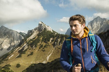 Austria, Tyrol, Tannheimer Tal, young man hiking - UUF002266