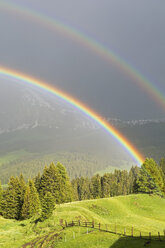 Italy, South Tyrol, Seiser Alm, Double Rainbow in front of Langkofel - UMF000730
