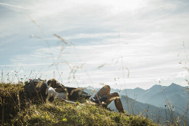 Austria, Tyrol, Tannheimer Tal, young hiker having a rest - UUF002190