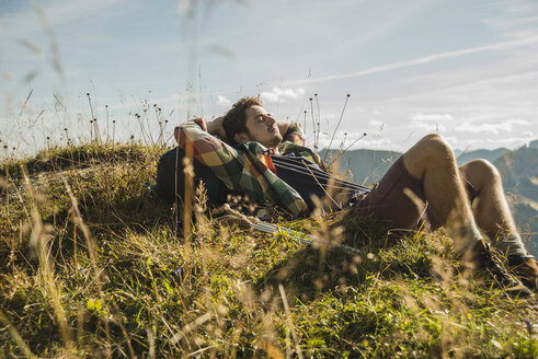 Austria, Tyrol, Tannheimer Tal, young hiker having a rest - UUF002186