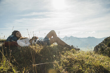 Austria, Tyrol, Tannheimer Tal, young hiker having a rest - UUF002177