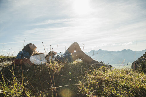 Austria, Tyrol, Tannheimer Tal, young hiker having a rest - UUF002176