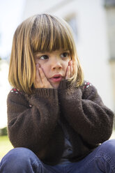 Portrait of little girl with head in hands - LVF002055