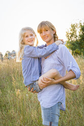 Mother and her little daughter enjoying country life - FKIF000054