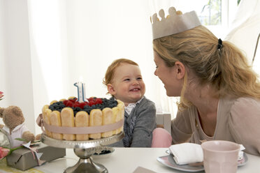 Mother and daughter celebrating little girl's first birthday with self-made fancy cake - FSF000229