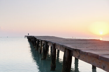 Spain, Balearic Islands, Cala de Muro, one man walking on a jetty - MSF004317