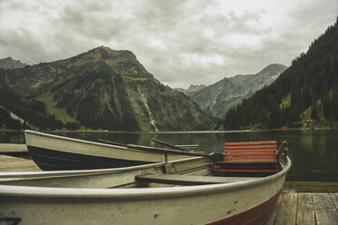 Austria, Tyrol, Tannheimer Tal, boats at mountain lake - UUF002328