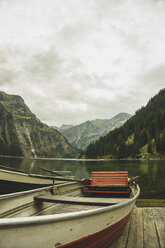 Austria, Tyrol, Tannheimer Tal, boats at mountain lake - UUF002329