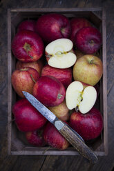 Wooden box of red apples and a pocket knife - LVF002075