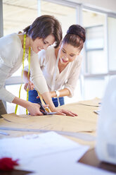 Two dressmakers working in tailor shop - ZEF001536