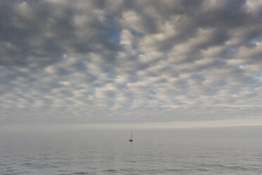 Germany, Baltic Sea, sailing boat resting at the sea under cloudy sky - MELF000035