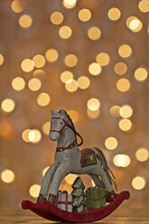 Christmas rocking horse in front of points of light - MELF000032