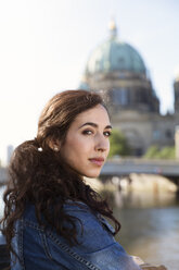 Germany, Berlin, portrait of young female tourist on city trip - FKF000706