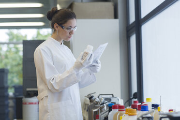 Young female scientist working in a chemical lab - SGF000898