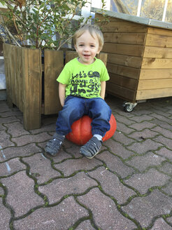 Little Boy sitting on pumpkin - AFF000124