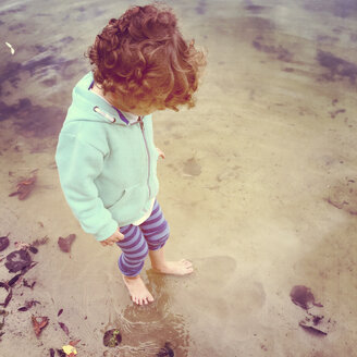 Boy wading in water - AFF000130