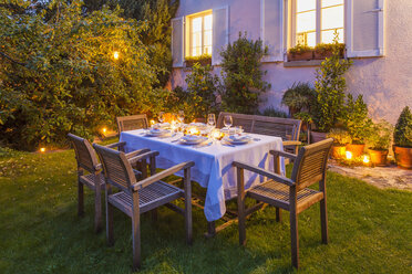 Autumnal laid table in garden in the evening - WDF002733