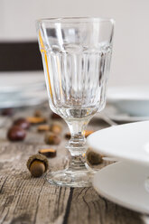 Crystal wine glass on autumnal laid table - LVF002092