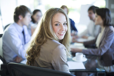 Smiling woman in a business meeting - ZEF002177