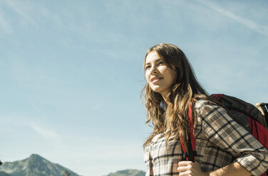 Austria, Tyrol, Tannheimer Tal, smiling young woman on hiking trip - UUF002419