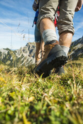 Austria, Tyrol, Tannheimer Tal, close-up of young couple hiking - UUF002434