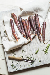 Prepared Purple Haze and peeler on cloth and wooden board - SBDF001425