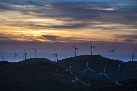 Spain, Andalusia, Tarifa, Wind farm in the evening light stock photo