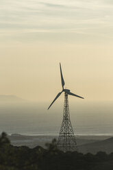 Spain, Andalusia, Tarifa, Wind wheel in the evening light - KBF000242