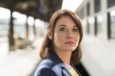 Young woman at train station - UUF002494