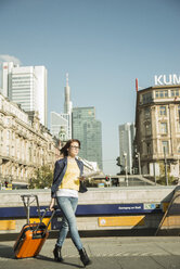 Germany, Frankfurt, young businesswoman on the move in city center - UUF002506