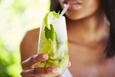 Woman drinking Mojito, partial view - ZEF001782