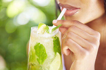 Woman drinking Mojito, partial view - ZEF001783