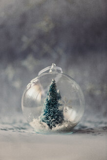 Christmas bauble made of glass with fir tree and artificial snow inside - JPF000017