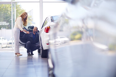 Couple at car dealer - ZEF002042