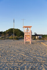 Spain, Balearic Islands, Majorca, one teenage boy standing on a lifeguard stand - MSF004352