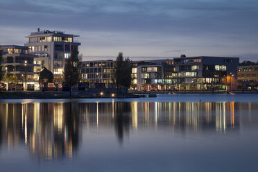 Germany, North Rhine-Westphalia, Dortmund-Hoerde, Phoenix Lake, Residential and office buildings, Specialist Medical Centre, S.E.A. House in the evening - WIF001153